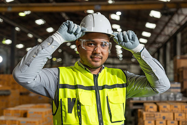 istock Close up technician engineer wearing and adjust protective safety helmet or hard hat. Safety equipment for industry factory. Safety at work concept. 2207949063