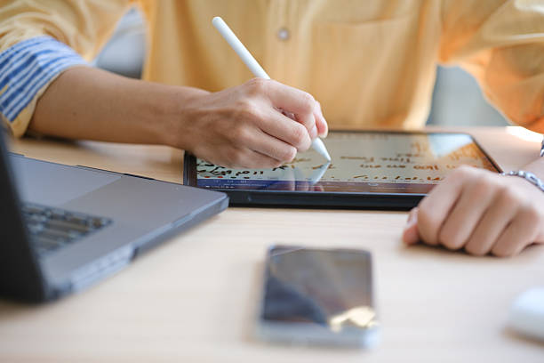 istock Male web designer drawing with graphic tablet at table in office. 2207951934