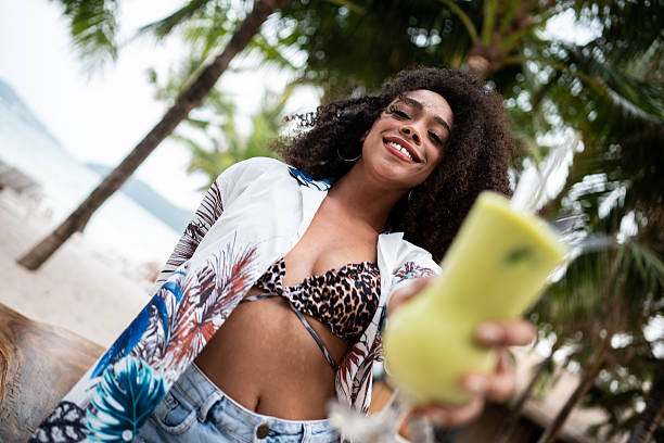 istock Black Woman Toasting to Paradise 2207953211