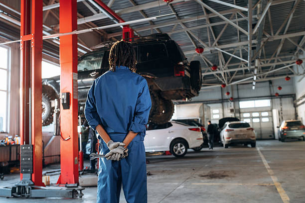 istock Male mechanic is with car in garage 2207954766