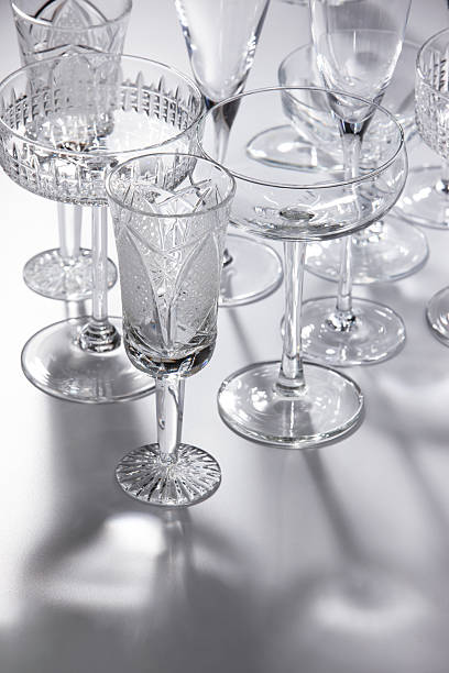 istock Empty crystal champagne and cocktail glasses. of different shapes. 2207957873