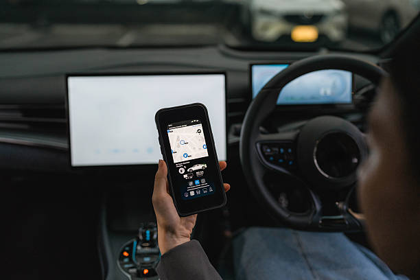 istock A woman exploring various features on the EV car's smart application through her smartphone 2207959042