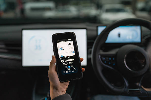 istock A woman exploring various features on the EV car's smart application through her smartphone 2207959048