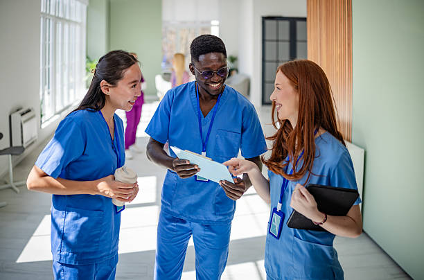 istock Young healthcare professionals collaborate in a modern hospital setting while discussing patient care strategies 2207960107