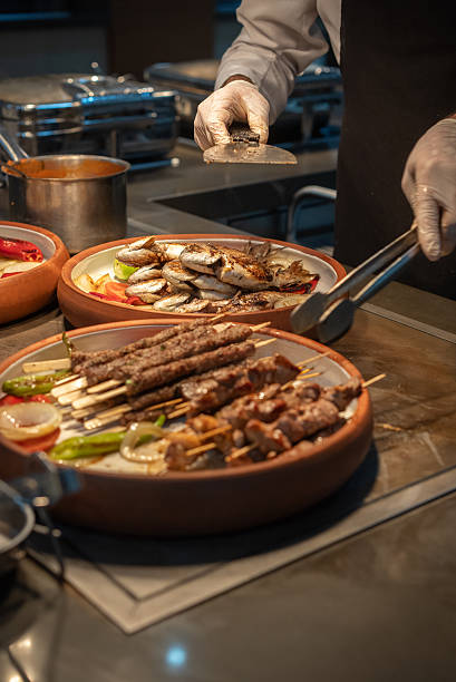 istock The Chef is Serving Fried kebab on the Buffet for Dinner. 2207961497
