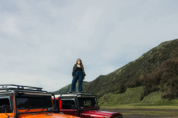 istock Traveller Exploring Bromo Volcanic Landscape by 4X4 Car in Indonesia 2207962552