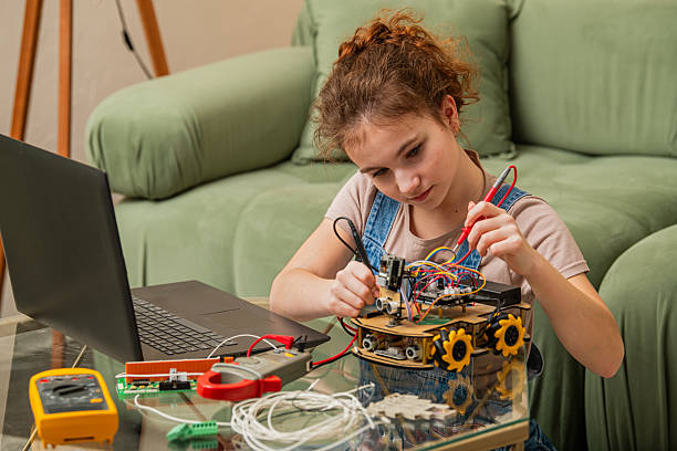 istock Girl Building a Robotics Project at Home 2207962882