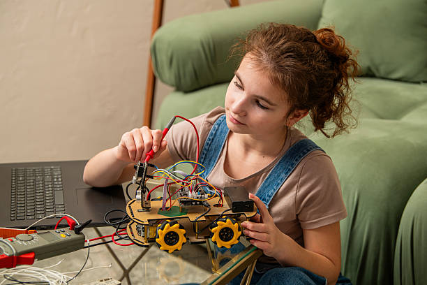 istock Girl Building a Robotics Project at Home 2207962924