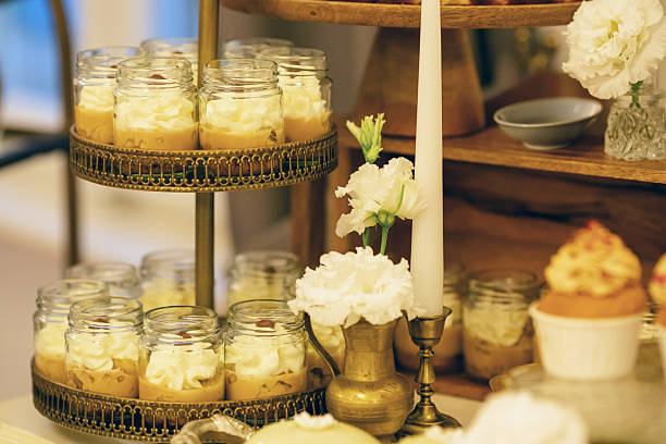 Bite-sized fruit, vanilla, and chocolate desserts served on a sweet table at a wedding. A tempting, high-calorie indulgence perfect for satisfying your sweet tooth.