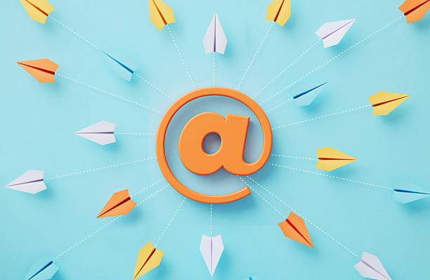 Paper planes and at symbol which are connected by dotted lines on blue background, Social media and networking concept.