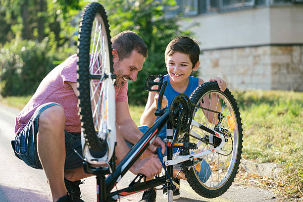 istock Engaging father and son bike repair experience 2207964585