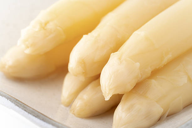 Close-up of boiled white asparagus