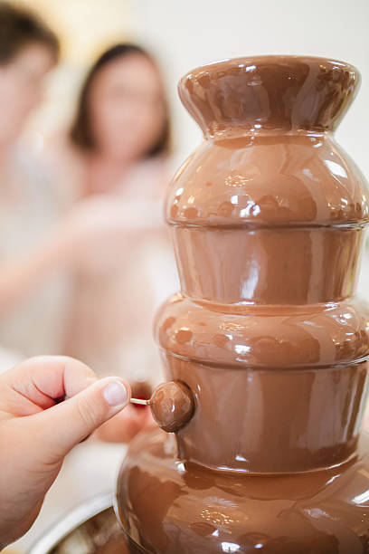 istock Milk Chocolate Fountain at a Wedding – Sweet Reception Attraction 2207965032