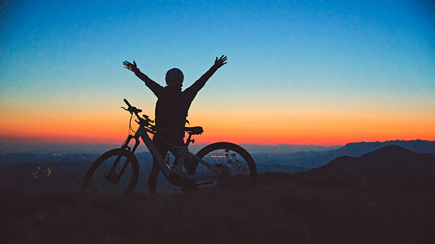 istock Silhouette of Sunset Cycling Success 2207965122