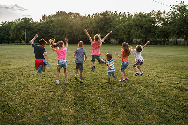 istock Carefree children jumping on a meadow 2207967766