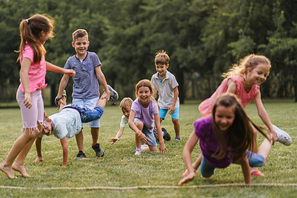istock Carefree children having fun playing on a meadow 2207967867