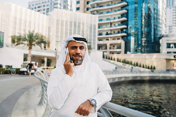 istock Arab businessman talking on phone in Dubai Marina 2207968736