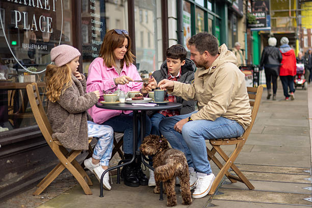 istock Happy Family Having a Coffee Break 2207969729