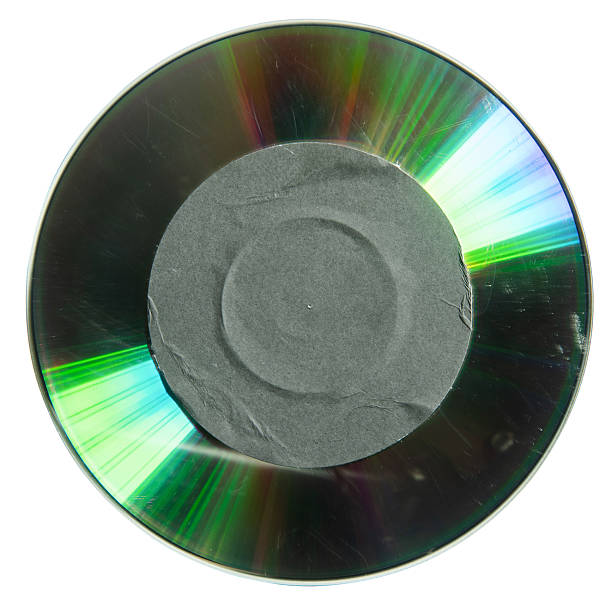istock Reflective side of cd with black circular label sticker 2207971082