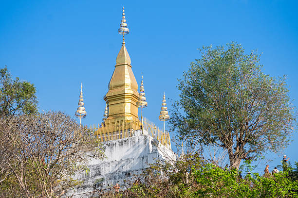 istock Luang Prabang, Laos, Golden Stupa is beautifully surrounded by lush greenery 2207971459
