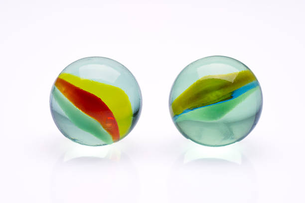 istock Colored glass marbles ball on white background 2207980705