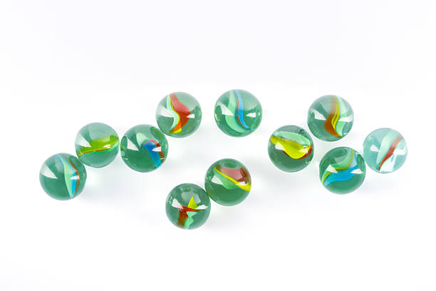 istock Colored glass marbles ball on white background 2207980712