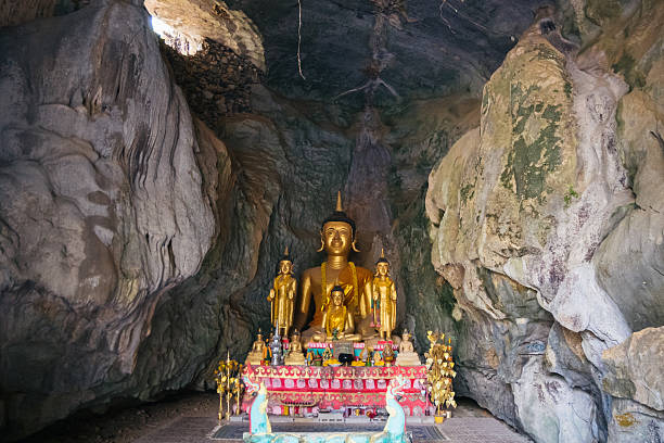 istock The enchanting Golden Buddha Statue situated within a serene Cave Sanctuary captivates visitors 2207981379
