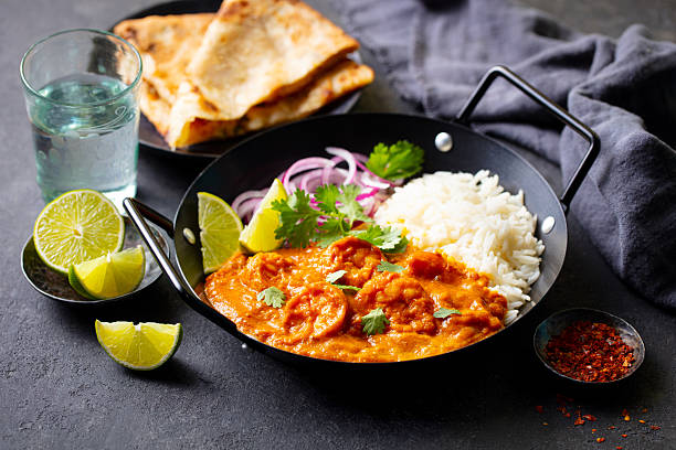 istock Kerala prawns curry in black bowl. Grey background. Close up. 2207983237
