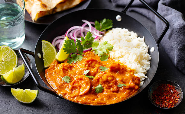 istock Kerala prawns curry in black bowl. Grey background. Close up. 2207983305