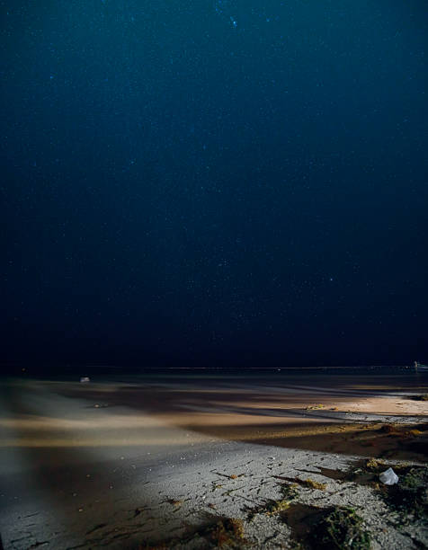 istock Starry night sky illuminating mahahual beach in quintana roo 2207983937