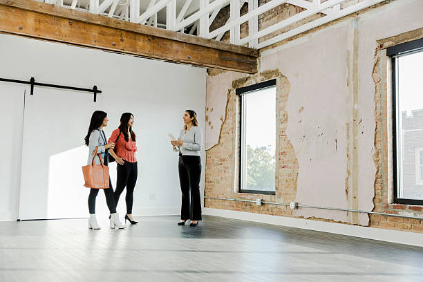 istock Three Women View Empty Commercial Space for Lease 2207983992