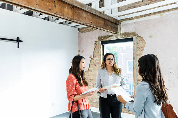 istock Three Businesswomen Discussing Documents in an Office 2207984029