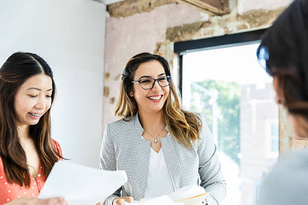 istock Three Diverse Businesswomen Collaborating in Office 2207984031