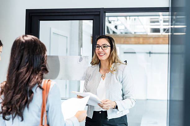 istock Businesswomen Meeting, Discussing Documents, Teamwork 2207984048