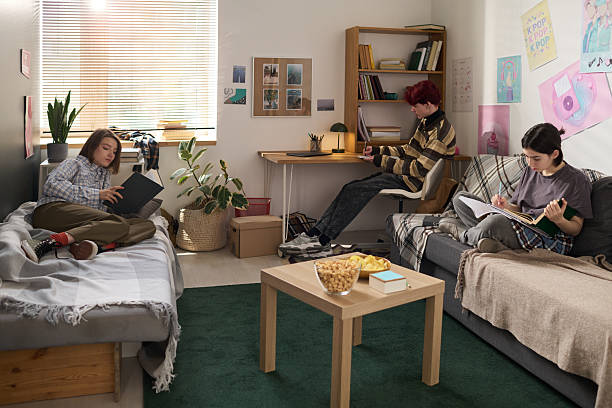 istock Three Teen Friends Studying in Dorm Room 2207984169