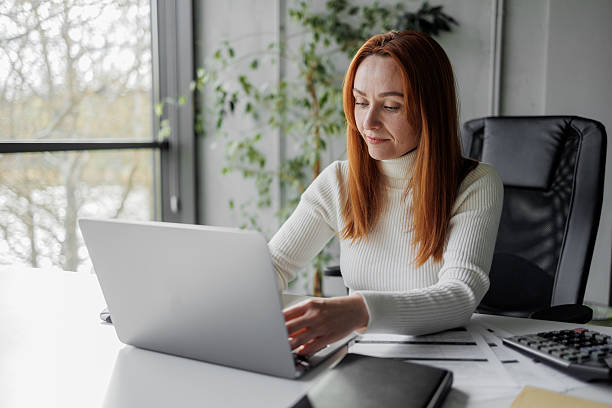 istock Woman Working at Laptop in Modern Office 2207987089