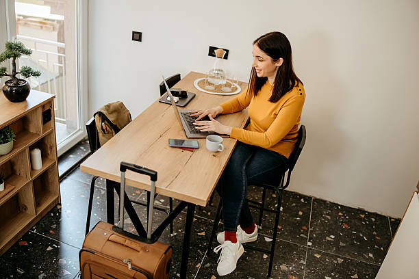 istock Woman uses a laptop before a trip 2207989987