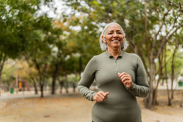 Senior woman running on public park