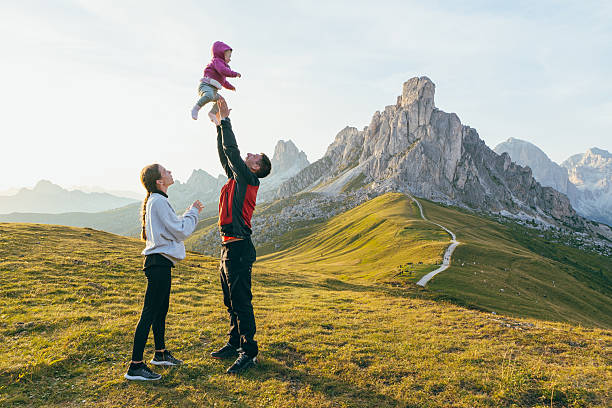 istock Parents Playing with Baby in Scenic Mountain Landscape 2207992076