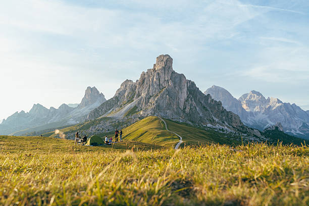 istock Group Camping at the Foot of Dramatic Mountain Peaks 2207992079