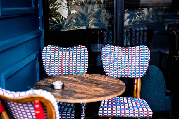 istock Paris, France: Traditional Blue and White Chairs at Sidewalk Cafe 2207994369