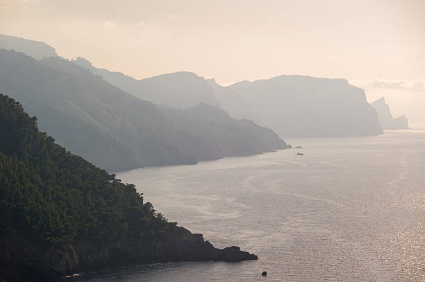Misty Coastal Scene with Mountains and Sea