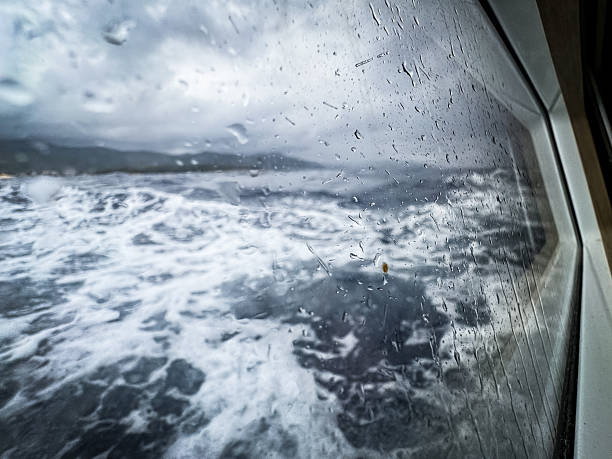 View from left rear cabin of sailboat during fast sailing.