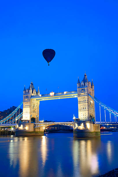 istock The Tower Bridge with one hot air balloon in sky 2208002876