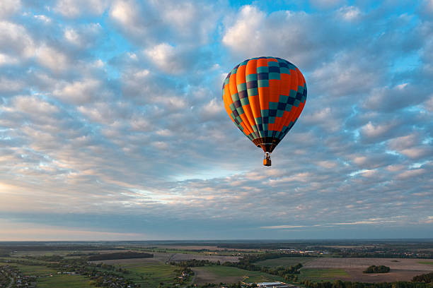 istock Hot air balloon in blue sky at sunrise 2208005951
