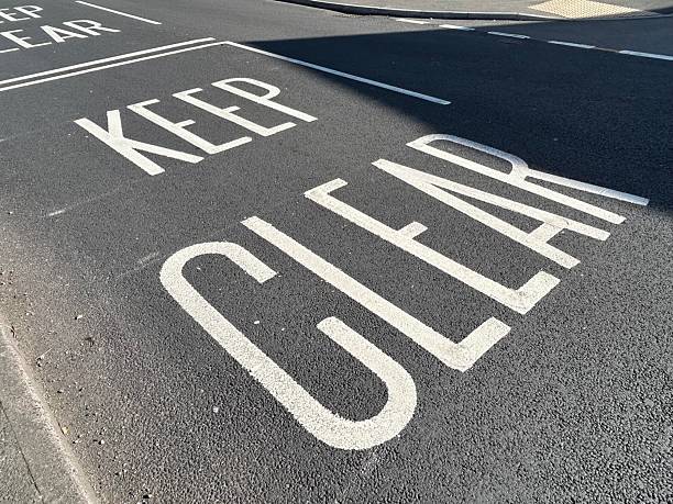 istock White road markings painted on asphalt road surface 