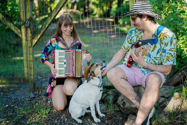 istock Musicians playing instruments with their dog in a garden 2208006750