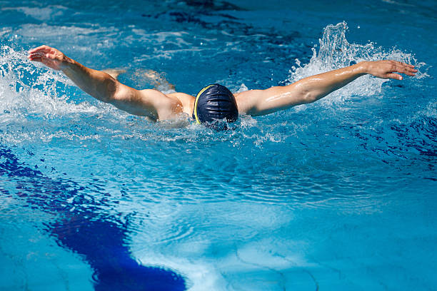 istock Skilled athlete performing the butterfly stroke 2208008148