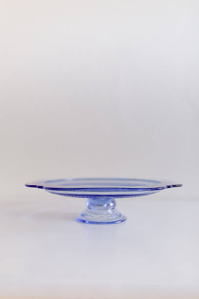 istock A Vintage Blue Depression Glass Cake Stand with a White Background 2208008171