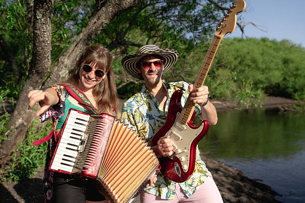 istock Musicians playing accordion and guitar by the river 2208009212